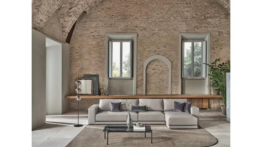 Divano in ecopelle con penisola Pitagora di Bontempi
