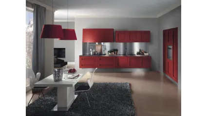 Cucina Design ad angolo sospesa Melograno in Rovere tinto Rosso con top in acciaio inox di Composit